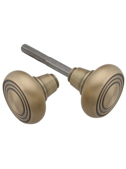 Pair of Streamline Deco Door Knobs in Antique Brass.